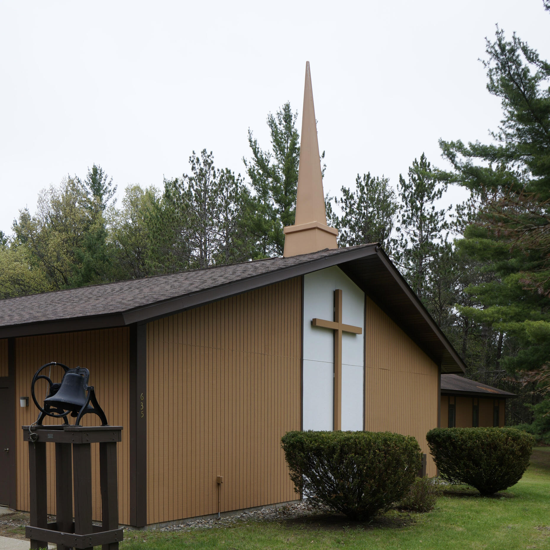 Exterior of Hope Lutheran Church in St. Helen, MI. Exterior of a wooden church building: Hope Lutheran Church in St. Helen, MI.